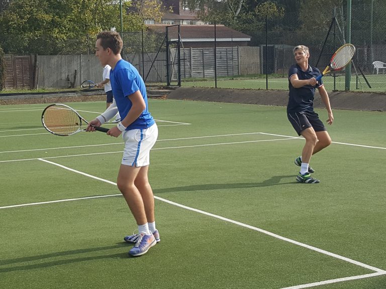 A player following through on a forehand during a match